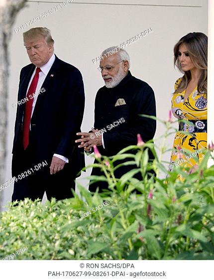 United States President Donald J. Trump and first lady Melania Trump walk on the Colonnade to the Oval Office with Prime Minister Narendra Modi of India at the...