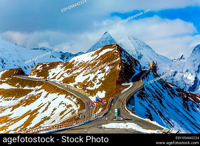 Dizzy turns of mountain serpentine. Sunny cold day. Alpine panoramic mountain road Grossglocknerstrasse. Austrian Alps. The concept of active