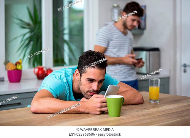 Man using phone at table