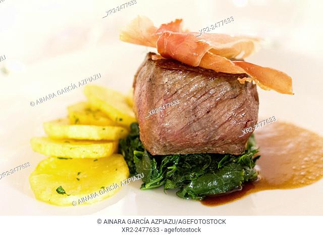 Meat with potatoes and spinach