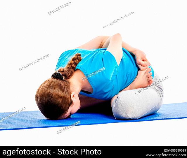 Yoga - young beautiful slender woman yoga instructor doing Psychic Union Pose (forward bend baddha padmasana, yoga mudrasana) asana exercise isolated on white...