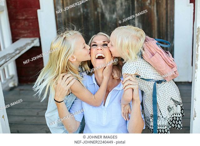 Happy mother with two daughter