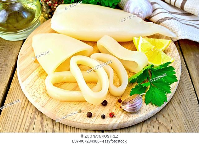 Calamari with lemon and garlic on board