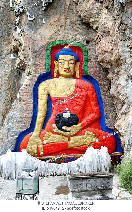 Tibetan Buddhism, colorful Atisha rock relief with a large Buddha Shakyamuni, in Lhasa, Himalayas, central Tibet, Ue-Tsang, Tibet Autonomous Region