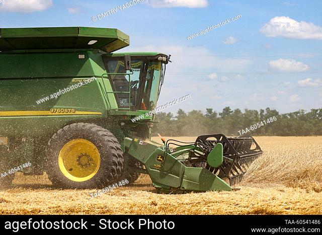 RUSSIA, DONETSK PEOPLE'S REPUBLIC - JULY 19, 2023: A combine harvests wheat as Volodarsky District enters an early crops and legumes harvest campaign