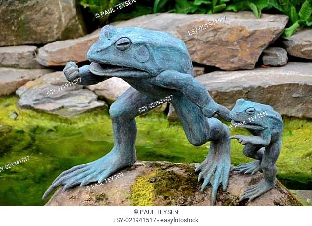Statue of a frog in a garden