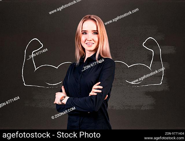 Young business woman with drawn powerful hands behind