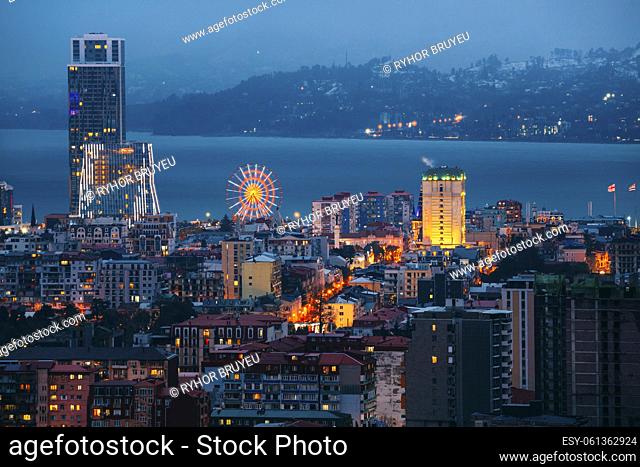 Batumi, Adjara, Georgia. Elevated view Ferris Wheel At Promenade In Miracle Park, Amusement City Park during Evening twilight night