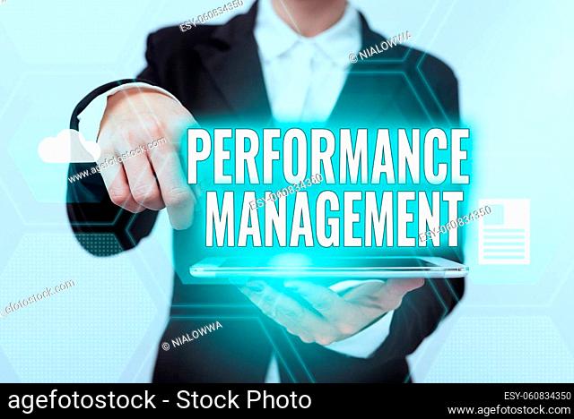 Text sign showing Performance Management, Internet Concept Improve Employee Effectiveness overall Contribution Lady In Suit Pointing On Tablet Showing...
