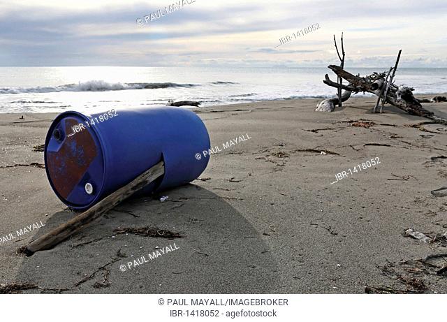 Blue plastic barrel washed up on beach