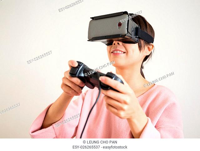 Young Woman play video game with virtual reality