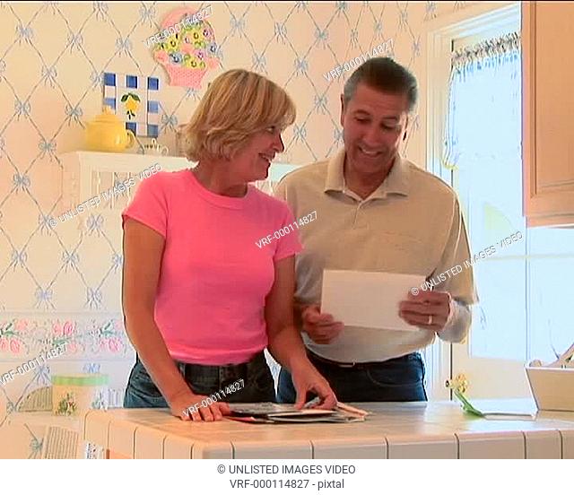 Mature couple going through mail