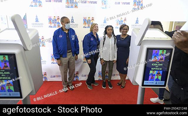 Attendees for the screening the NASA produced documentary “The Color of Space” get their photos taken with former NASA astronaut Alvin Drew, left