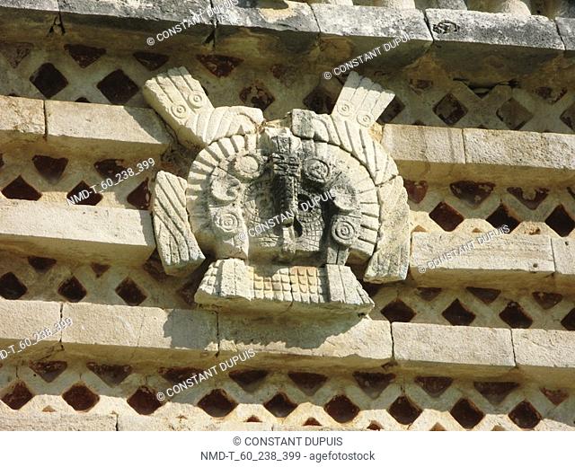 Close-up of a sculpture on a stone wall, Nunnery Quadrangle, Uxmal, Yucatan, Mexico