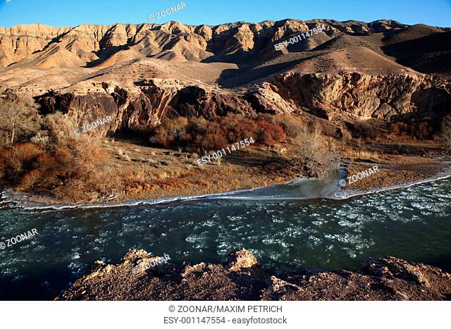 Ice floe in desert mountain river
