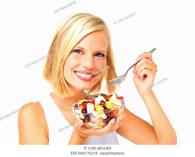 Portrait of a beautiful blonde smiling and ready to eat a bowl of fruit salad