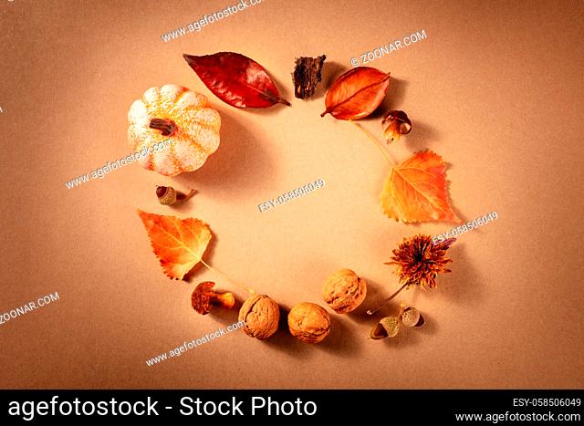 Autumn wreath, shot from the top with a place for text on a brown background