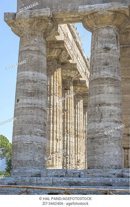 foreshortening of columns at Hera temple Doric peristyle, shot in bright summer light at Paestum, Salerno, Campania, Italy