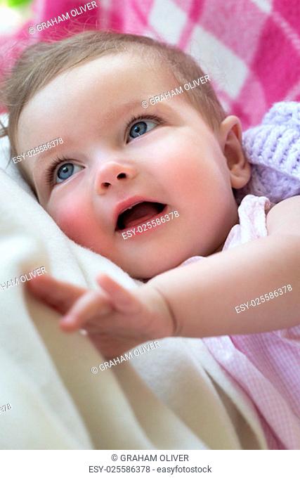 Close up of baby Smiling and looking up