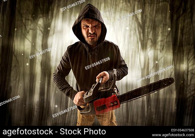 Scary Muscular Young Man with Pointed Hood on Naked Body Stock