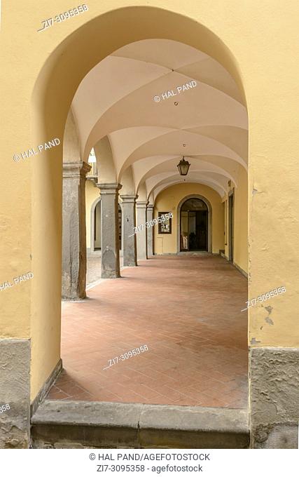 detail of old house vaulted arcade, shot in bright light on Sebino lake at Lovere, Bergamo, Lombardy, Italy