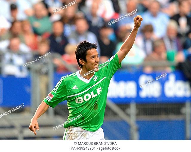 Wolfsburg's Makoto Hasebe celebrates his 1-1 goal ball during the Bundesliga soccer match between Hamburger SV and VfL Wolfsburg at Imtech Arena in Hamburg