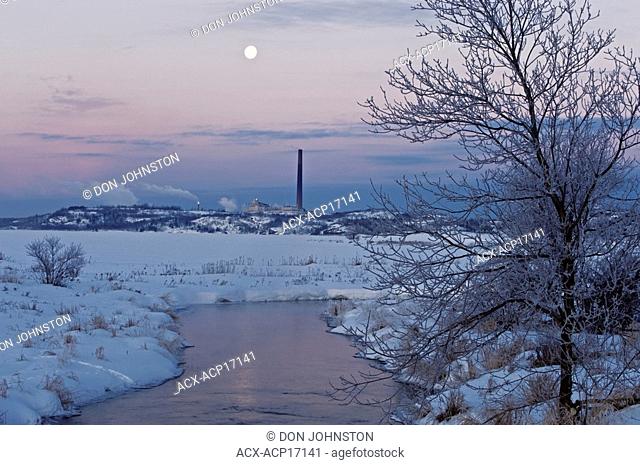 Setting moon over Vale INCO iron ore recovery plant near Kelly Lake, Sudbury, Ontario, Canada