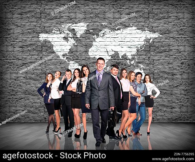 businessmen team over gray brick wall with world map background. Elements of this image furnished by NASA