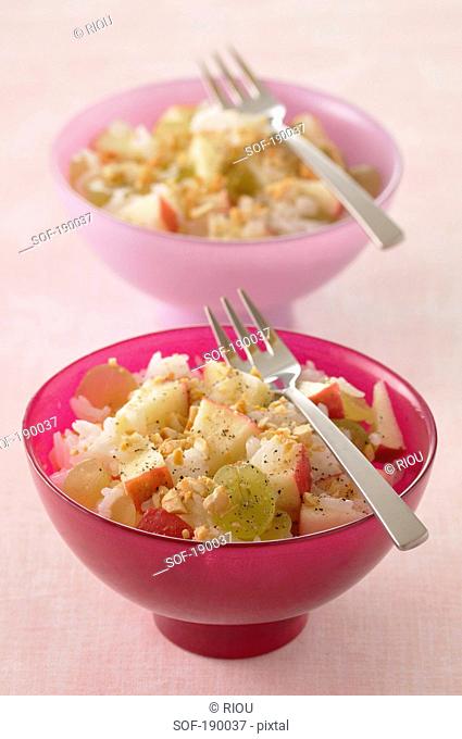 Long grain rice salad with apples, raisins and hazelnuts
