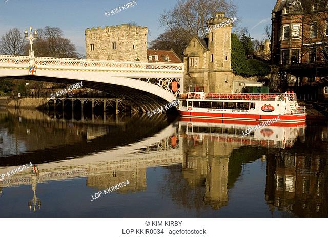 England, North Yorkshire, York, Lendal Bridge and a pleasure boat on River Ouse in York