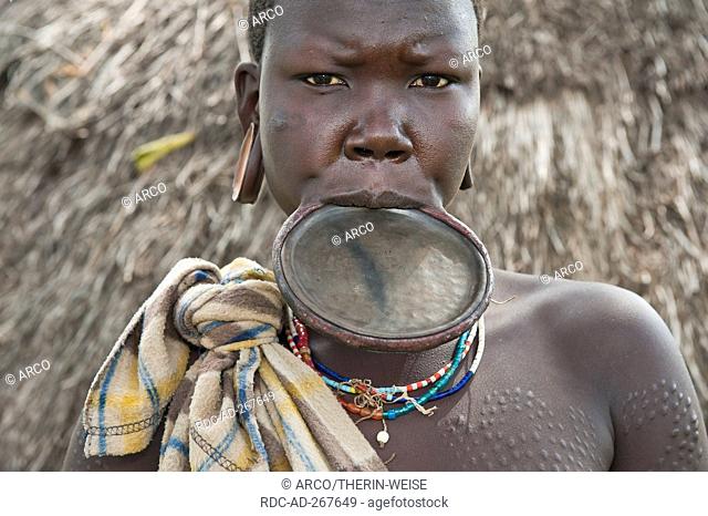 Surma woman with round lip plate, Kibish, Omo River Valley, Ethiopia