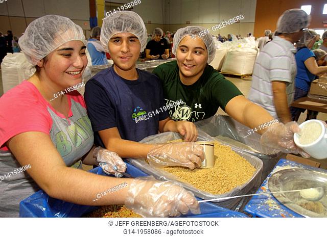 Florida, Miami, Miami-Dade County Fair And Expo, Feed My Starving Children, volunteer, community service, packing, meals, hairnet, Hispanic, teen, girl, student
