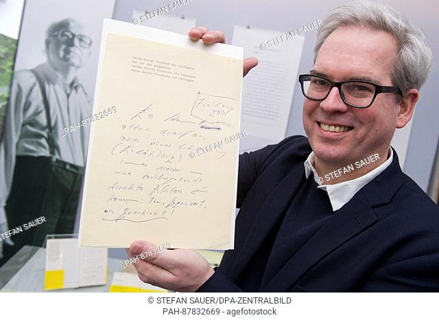Eckhard Schumacher, Professor for Modern German Literature and Koeppen researcher, holds up a typescript of Koeppen in Greifswald, Germany, 18 January 2017