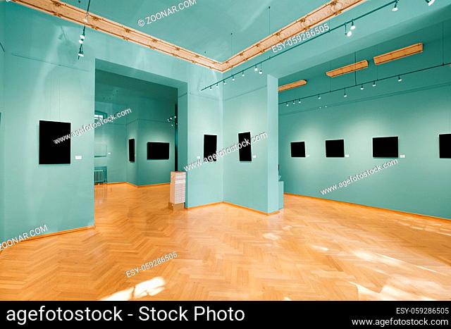 empty showroom or room in gallery with colorful painted walls and picture frames mock-up