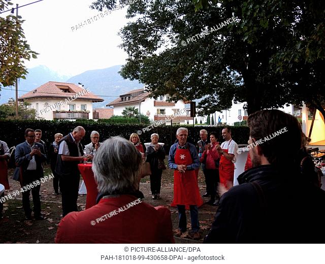 12 October 2018, Italy, Meran: Members of the ruling South Tyrolean People's Party (Südtiroler Volkspartei) are campaigning for votes at an election campaign...