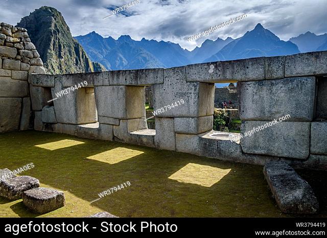 The path to Machu Picchu, the high mountain capital of the Inca tribe, a 15th century citadel site, buildings and view of the plateau and Andes mountains