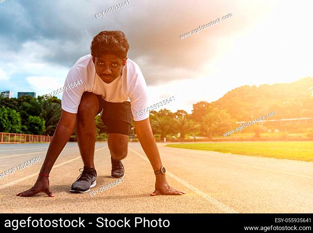 Asian young athlete sport runner black man wear feet shoe active ready to start running training at the outdoor on the treadmill for a step forward