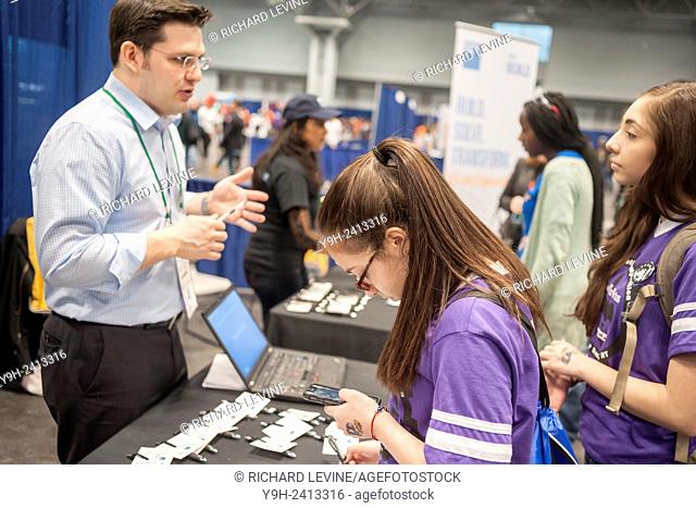 Participants visit the Goldman Sachs & Co. booth at a Career Expo held at the FIRST Robotics NYC Championship at the Jacob Javits Convention Center in New York