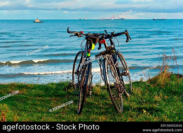 two bikes on the beach, two bikes on the coast