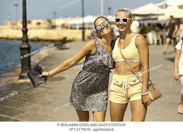 two women walking in Chania, Crete, Greece