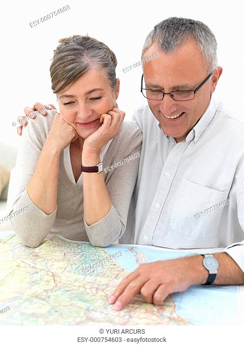 Ambitious older couple planing their travels
