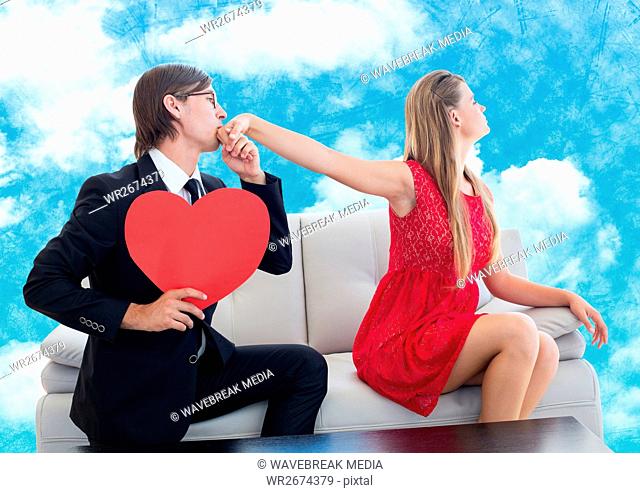 Man with red heart pleasing upset women