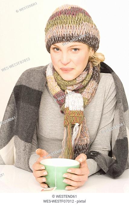 Woman with tea bowl, portrait
