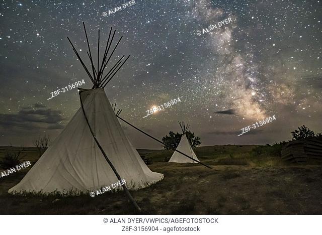 Mars and the Milky Way over the tipis at Two Trees area in Grasslands National Park, Saskatchewan on August 6, 2018. Some light cloud added the haze and glows...