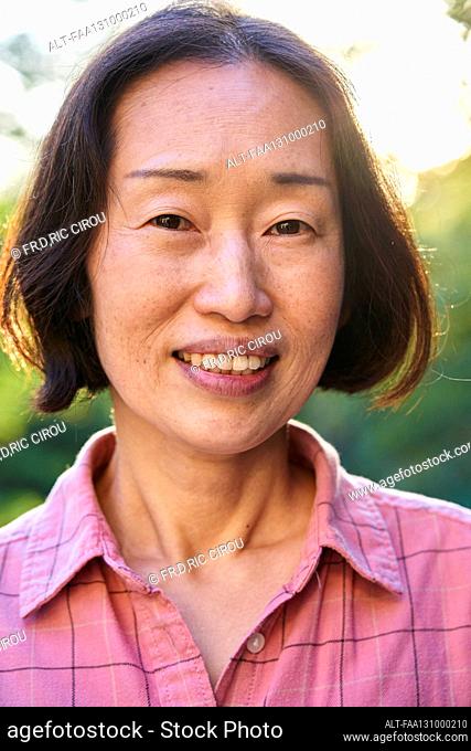 Senior Asian woman looking at the camera