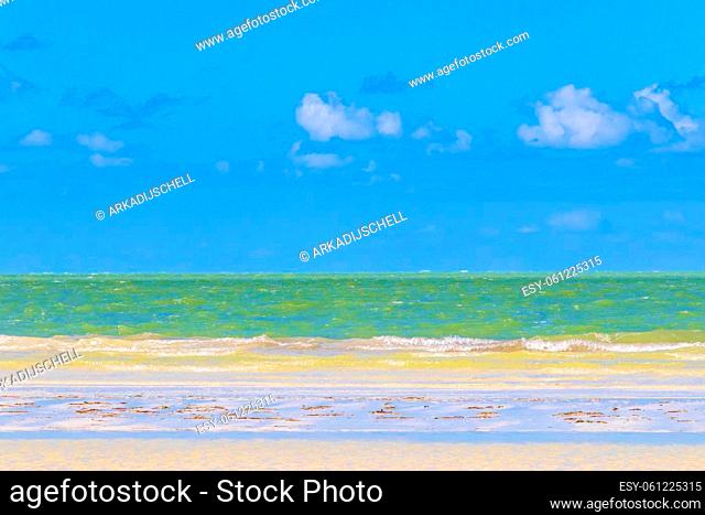 Natural panorama landscape view on beautiful Holbox island sandbank and beach with waves turquoise water and blue sky in Quintana Roo Mexico