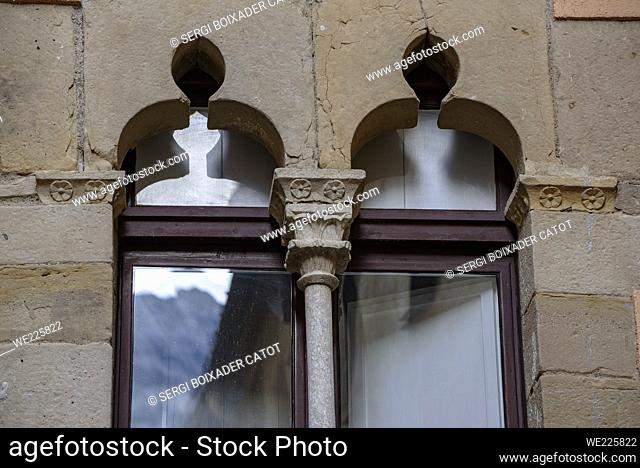 Sant Joan street in Monistrol de Montserrat. Windows with Gothic decoration (Bages, Barcelona, Catalonia, Spain)