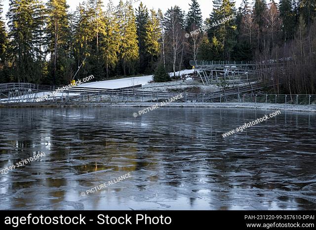 PRODUCTION - 18 December 2023, Bavaria, Bischofsgrün: A water reservoir on the northern slope of the Ochsenkopf for the production of artificial snow using snow...