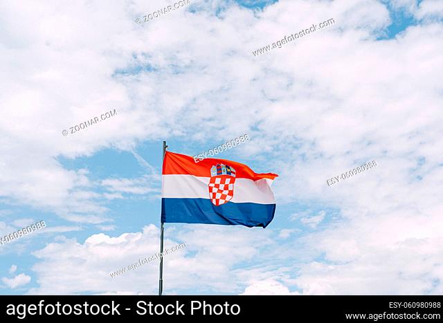 Croatian flag waving in the wind against the sky. High quality photo