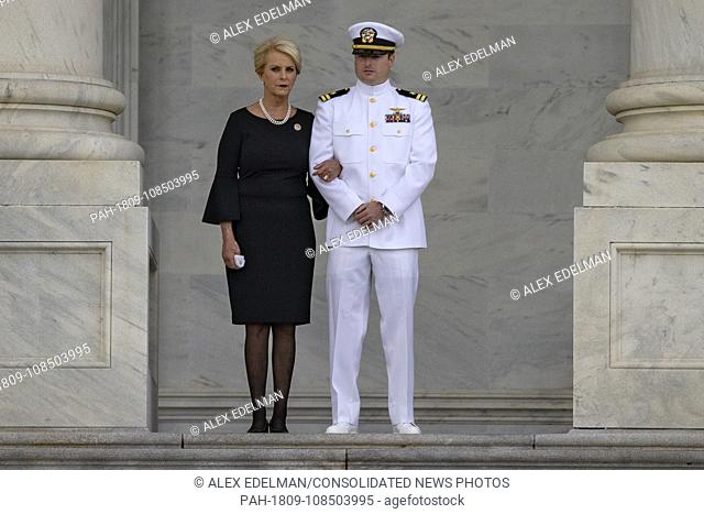 Cindy McCain and Jack McCain, the wife and son of late Senator John McCain look on as a United States Military Honor Guard carries the casket of former Senator...